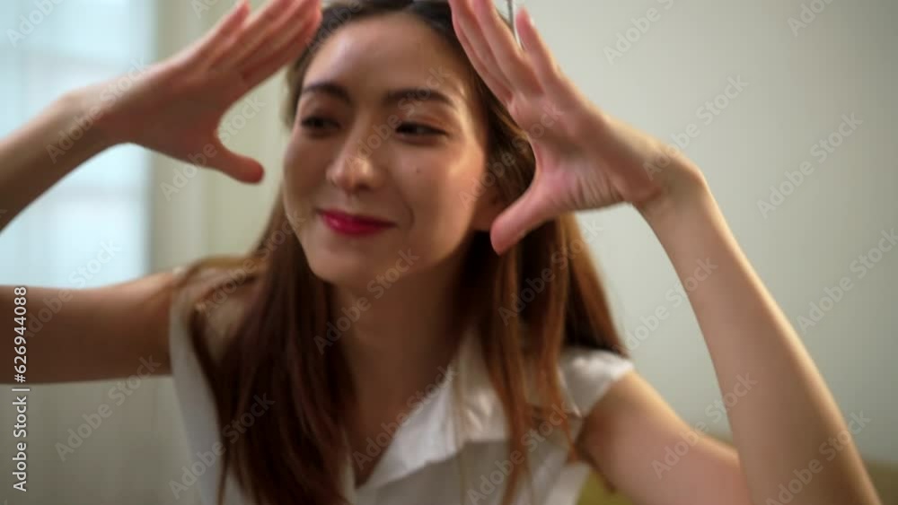 Asian young woman influencers streaming share dancing content, stories popular trendy dance on social media. Bloggers shooting created her dancing video for social network on smartphone at home. Asian young woman influencers streaming share dancing content, stories popular trendy dance on social media. Bloggers shooting created her dancing video for social network on smartphone at home.