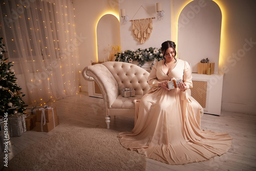 Fotografie Owerweight elegant Woman at Christmas room