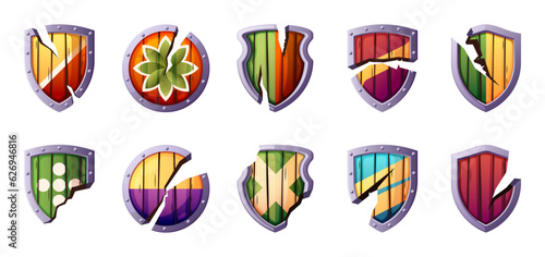 Game damaged shields. Cartoon fantasy military armor cracked and broken, GUI elements for RPG sprite asset. Vector isolated set. Fighting or battle elements. Warrior defense icon collection