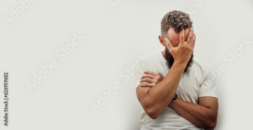 Cuadro en lienzo Homeless man drug addict and alcoholic sitting alone and depressed on the street
