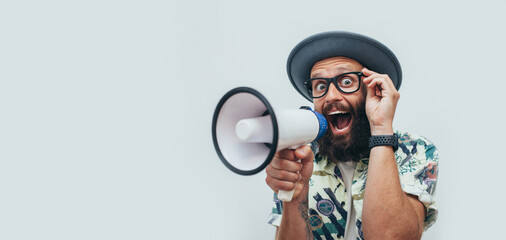 Funny portrait of an emotional hipster guy with a megaphone. Collage in magazine style. Flyer with trendy colors, advertising copy space. Discount, sale season. Information concept. Attention news!