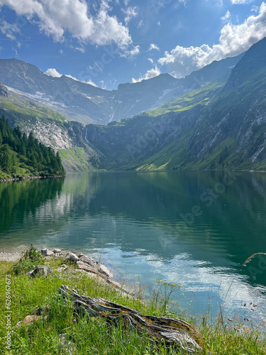 Summer landscape with mountains forests and cloudy sky in Alpes. Austria. Tranquility. Beauty and tranquility in farming. Natural and healthy living in a village. 