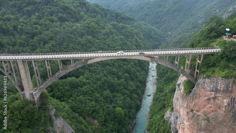 Djurdjevic is arched bridge across the Tara River. Montenegro. Aerial view. Djurdjevic is arched bridge across the Tara River. Montenegro. Aerial view.