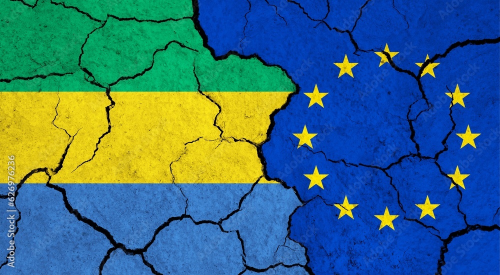 Flags of Gabon and European Union on cracked surface - politics, relationship concept