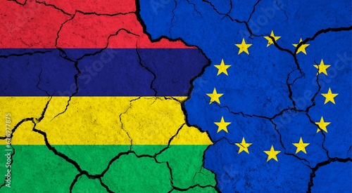 Flags of Mauritius and European Union on cracked surface - politics, relationship concept