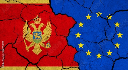 Flags of Montenegro and European Union on cracked surface - politics, relationship concept