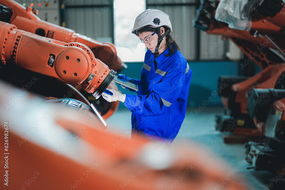 factory-engineer-woman-inspecting-on-machine-with-smart-tablet-worker