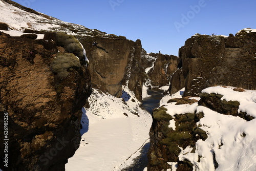  View on the canyon of Fjaðrárgljúfur in south east Iceland. The Fjaðrá river flows through it. It is up to 100 m deep and about 2 kilometers long. It is located near the Ring Road