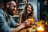 Smiling couple enjoying dinner meal and drink orange juice