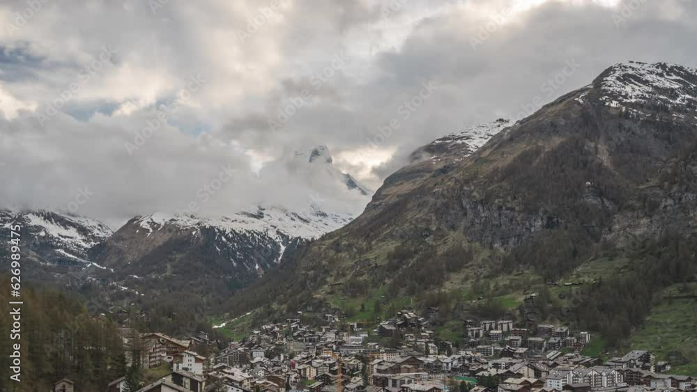 Zermatt Switzerland time lapse 4K, city skyline day to night timelapse at Zermatt city Valley and famous Matterhorn mountain peak Zermatt Switzerland time lapse 4K, city skyline day to night timelapse at Zermatt city Valley and famous Matterhorn mountain peak
