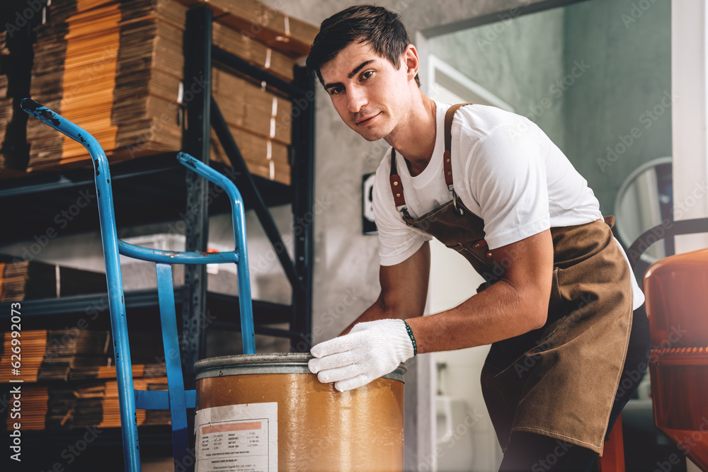 Small Business Owner's Caucasian Male Working in Coffee Beans Warehouse, Quality Coffee Production, Small Business Owner's Expertise in Coffee Roasting. Small Business Owner's Caucasian Male Working in Coffee Beans Warehouse, Quality Coffee Production, Small Business Owner's Expertise in Coffee Roasting.