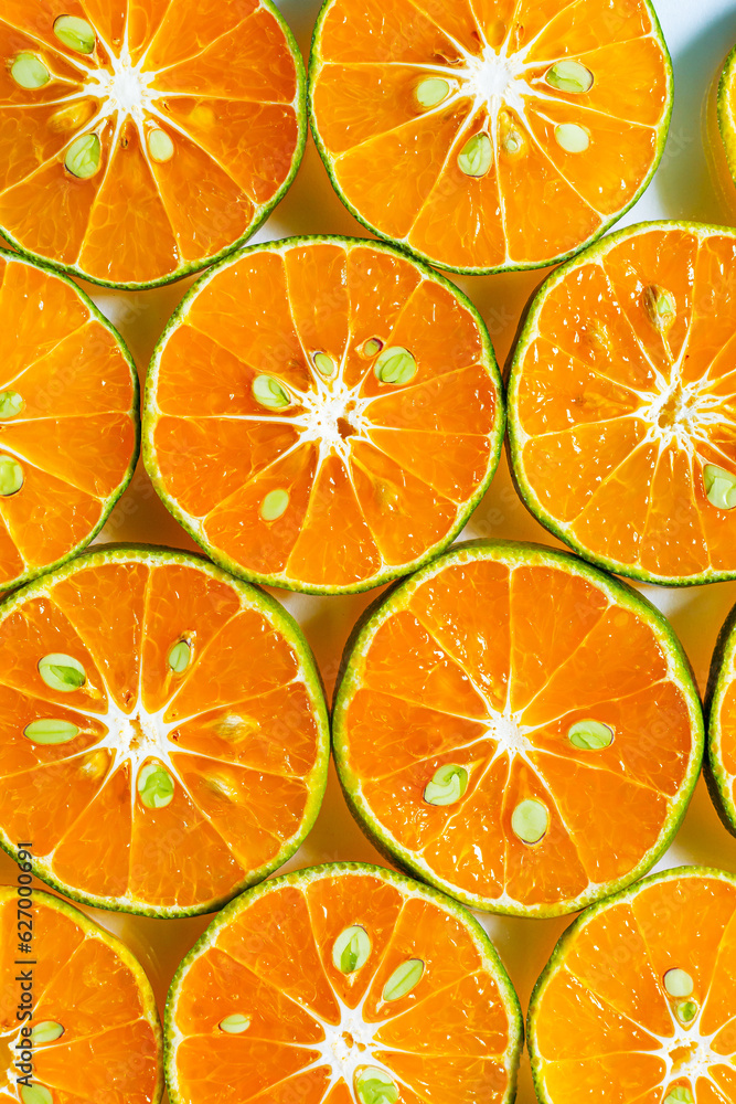 macro orange,Abstract background of orange citrus slices on white. macro orange,Abstract background of orange citrus slices on white.