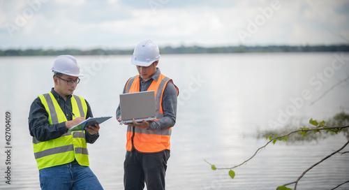 Fotografie, Tablou Environmental engineers inspect water quality,Bring water to the lab for testing