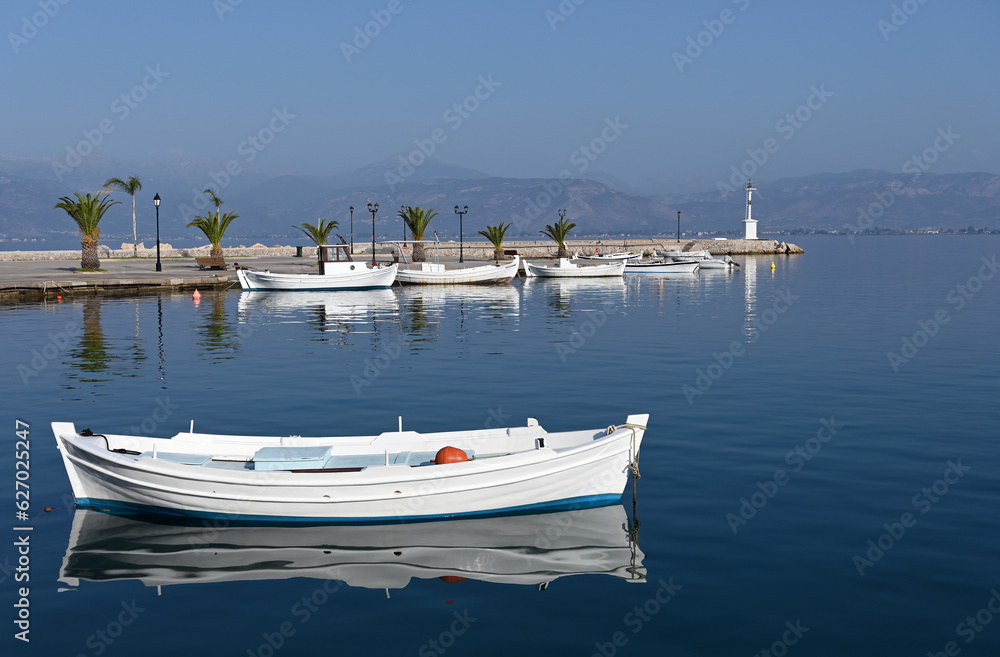 White boats and blue sea in the harbor Nafplio Greece