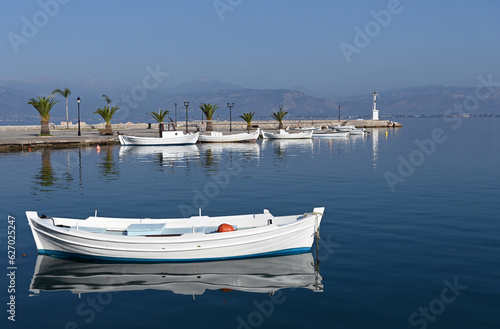 White boats and blue sea in the harbor Nafplio Greece