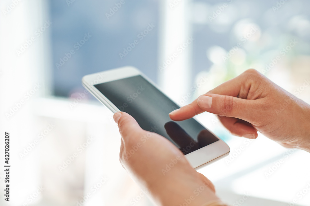 Success is one touch away. Cropped shot of an unrecognizable businesswoman using her smartphone inside of an office. Success is one touch away. Cropped shot of an unrecognizable businesswoman using her smartphone inside of an office.