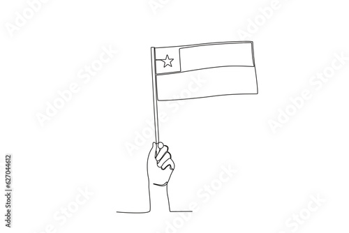 A hand holding the Chilean flag. Fiestas patrias chile