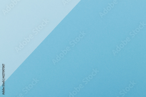 Multicolor background from a paper of different shades of blue. Geometric backdrop.