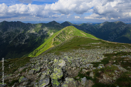 Rohace mountain ridge, view from Baranec, Western Tatras, Slovakia. Mountain landscape in summer during sunny day. Rocky tops and peaks of mountains and saddle. Wide angle with distorted corners. photo