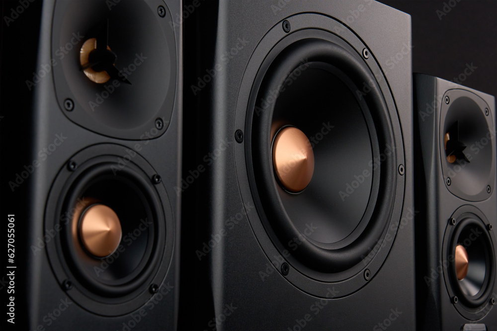 Multimedia acoustic sound speakers. Sound audio system with two satellites and subwoofer on dark background. Stereo system for listening music Multimedia acoustic sound speakers. Sound audio system with two satellites and subwoofer on dark background. Stereo system for listening music