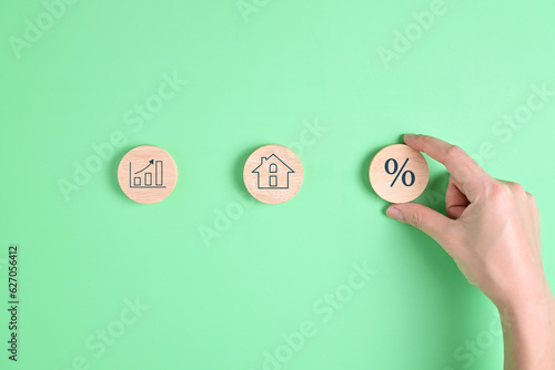 interest percent symbol icons on wooden house cube, home real estate.