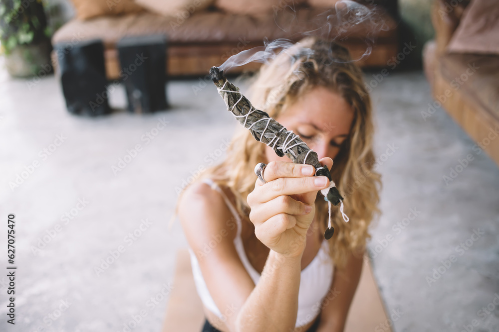 Relaxed woman with smoking herbal wrap