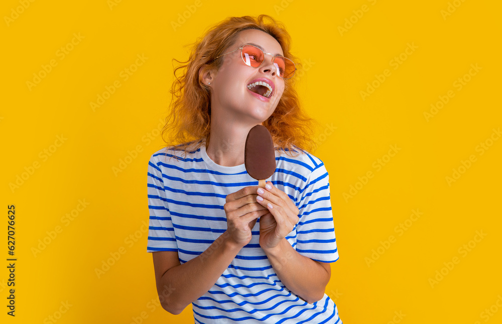 cheerful girl with delicious ice cream isolated on yellow. girl with delicious ice cream in studio. cheerful girl with delicious ice cream isolated on yellow. girl with delicious ice cream in studio.