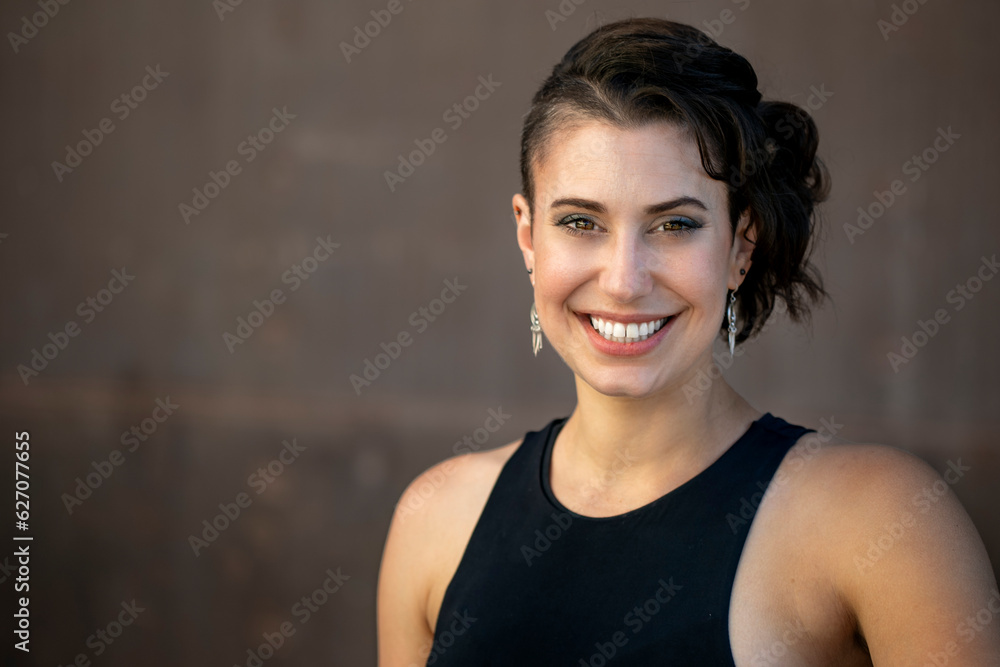 Friendly and warm portrait of a stylish young woman with a big natural smile, excited and happy person - obrazy, fototapety, plakaty 