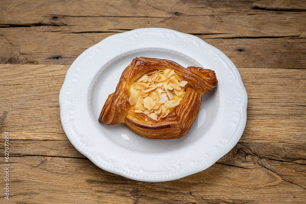 Delicious flavored pastries on a wooden table. Close up Delicious flavored pastries on a wooden table. Close up