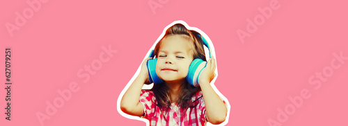 Portrait of happy little girl child in wireless headphones listening to music on pink background