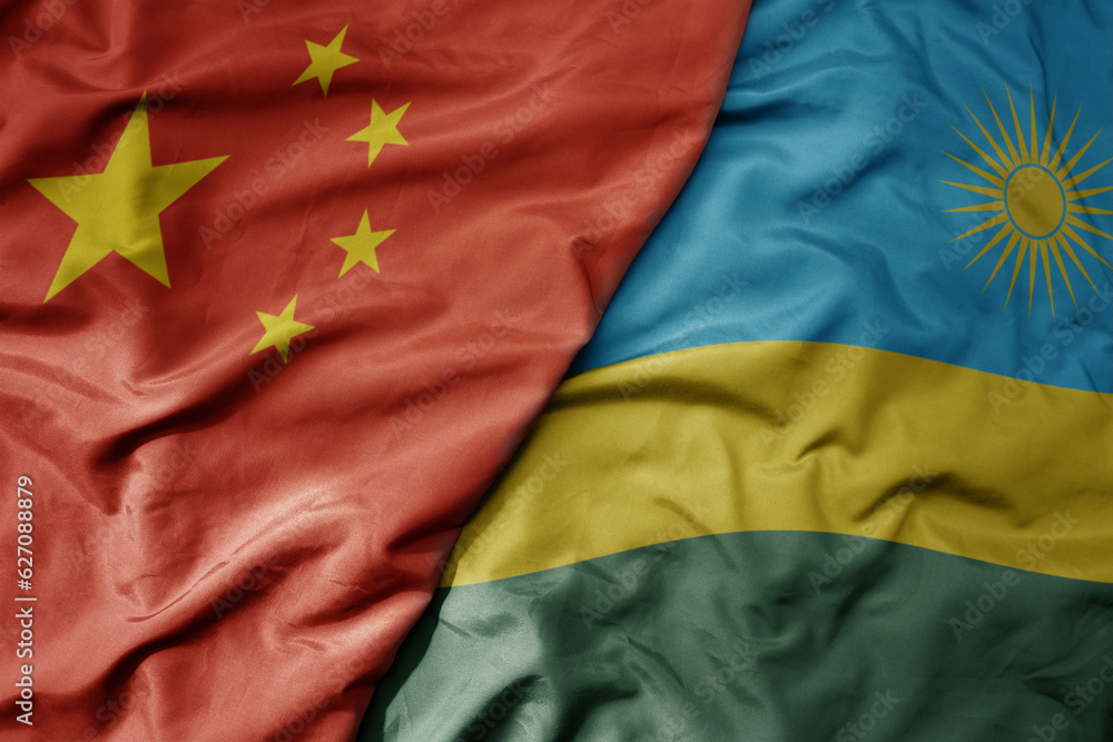 big waving national colorful flag of china and national flag of rwanda . big waving national colorful flag of china and national flag of rwanda .