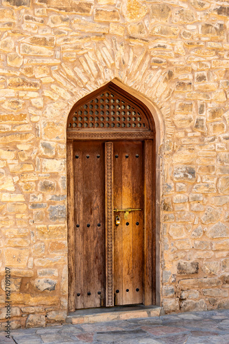 old wooden door in Sur, Oman © Allison