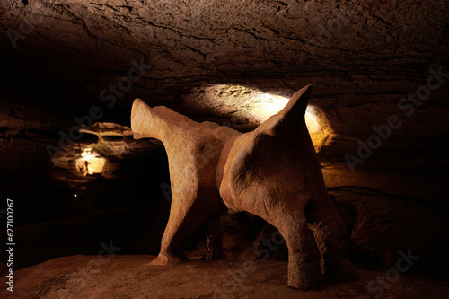 BURNET, TEXASUSA - JULY 3rd 2023: a family with a teenage girl on a road trip during school summer holidays, visiting Longhorn Cavern State Park with its intricate paths and natural stone works. photo