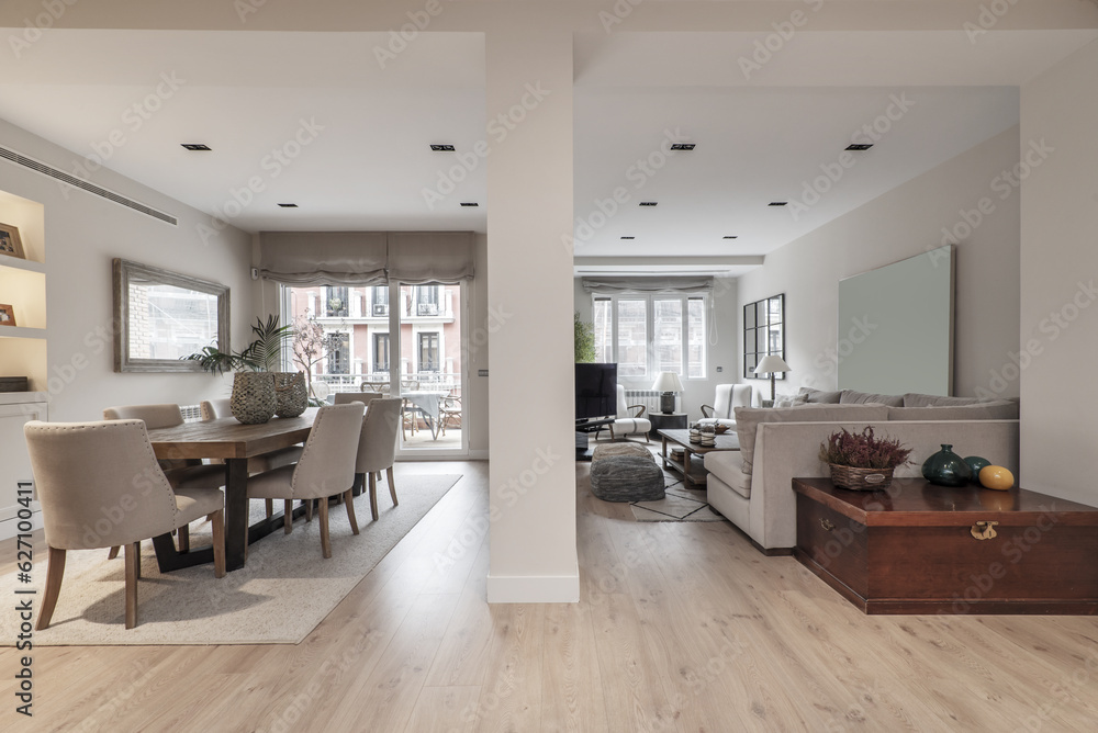 Fototapeta premium Living room of a house decorated with a large sofa upholstered