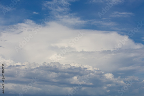 Fototapeta Naklejka Na Ścianę i Meble -  white fluffy clouds standing out against  a blue sky