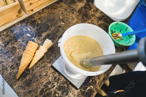 Canvas Print Closeup of professional blender whisking ice cream