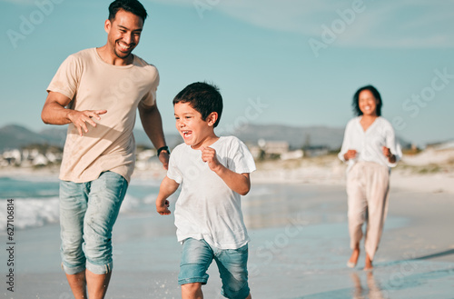 Family, father and son running on beach with mother, ocean and energy with bonding on holiday, happiness and freedom. Parents, boy and carefree on tropical vacation in Mexico, love and care outdoor