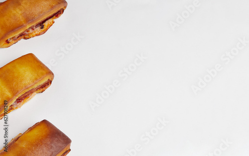 Lanche misto traditional portuguese sandwich with cheese and chorizo. Tasty breakfast over white background photo