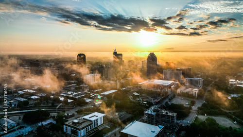 Golden Sunrise Over Raleigh Skyline with Fog - Aerial View