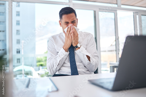Sick, allergy and blowing nose with business man in office for flu illness, hayfever and sneeze. Allergies, virus and sinus with employee and sneezing with tissue for influenza, cold and healthcare photo