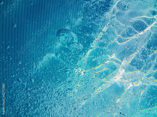 Blue pool water bubbles background texture © Alex Jauk