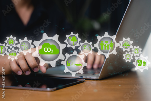 Quadro su tela Reduce CO2 emissions and carbon footprint to limit global warming and climate change