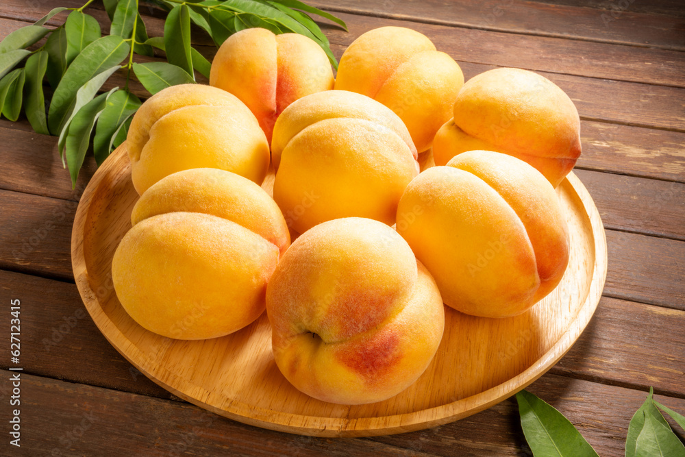 Yellow Peach with sliced on wooden Background, Fresh peach in wooden basket on wooden Background.