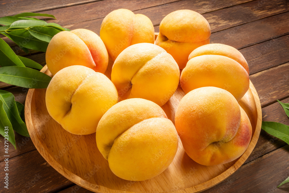 Yellow Peach with sliced on wooden Background, Fresh peach in wooden basket on wooden Background. Yellow Peach with sliced on wooden Background, Fresh peach in wooden basket on wooden Background.