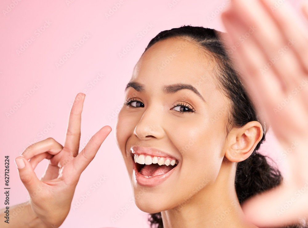 Selfie, peace sign and happy woman in studio with natural beauty, wellness and cosmetics. Portrait, female person and pink background with makeup and face with skincare and emoji hand gesture of girl Selfie, peace sign and happy woman in studio with natural beauty, wellness and cosmetics. Portrait, female person and pink background with makeup and face with skincare and emoji hand gesture of girl