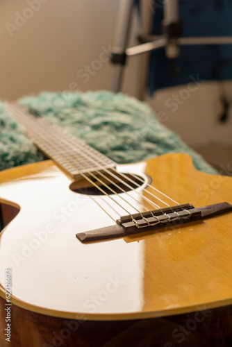 wooden electroacoustic guitar with nylon strings photo