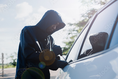 Εκτύπωση καμβά Close-up car thief hand holding screwdriver tamper yank and glove black