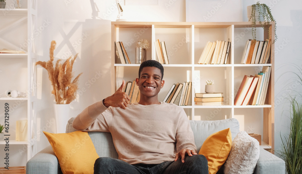 Approval gesture. apartment. Excited happy smiling man with