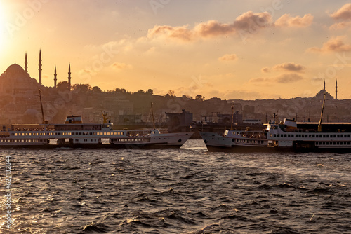 two ferries travel on the goldenhorn in Istanbul photo