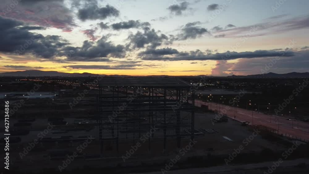Ariel orbit of new steel superstructure building at dawn just at sunrise. Ariel orbit of new steel superstructure building at dawn just at sunrise.